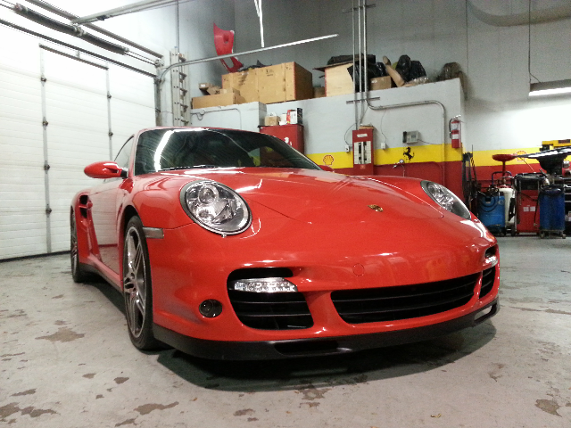 Red porsche car repairing