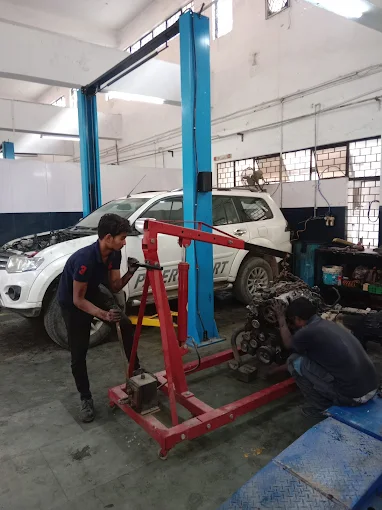 Experienced Audi technicians performing engine repair at XL Car Care